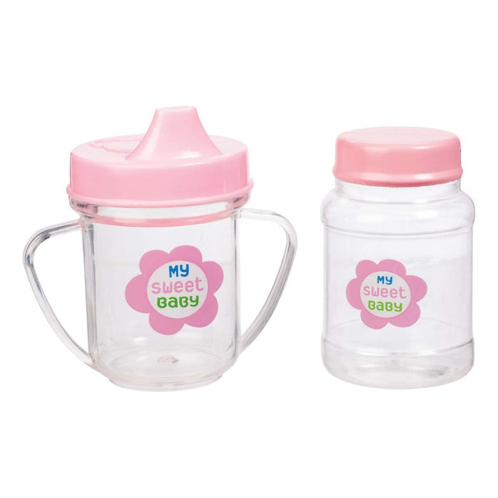 My Sweet Baby Dlx Baby Ensemble by My Sweet Baby includes two clear plastic baby cups with pink lids and flower designs—one with handles and sippy spout, the other with screw-on lid—perfect doll accessories for pretend play.