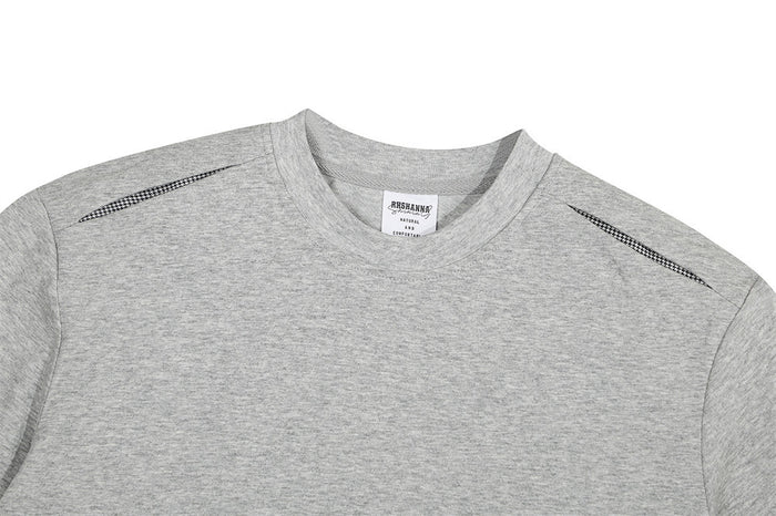 Gray oversized crewneck T-shirt with shoulder stitch detailing and a soft heathered fabric texture on a white background