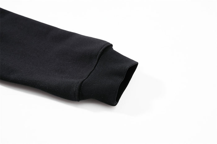 Close-up of black sweatshirt sleeve cuff with ribbed knit trim