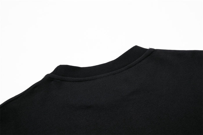 Close-up of black sweatshirt back neckline and shoulder seam