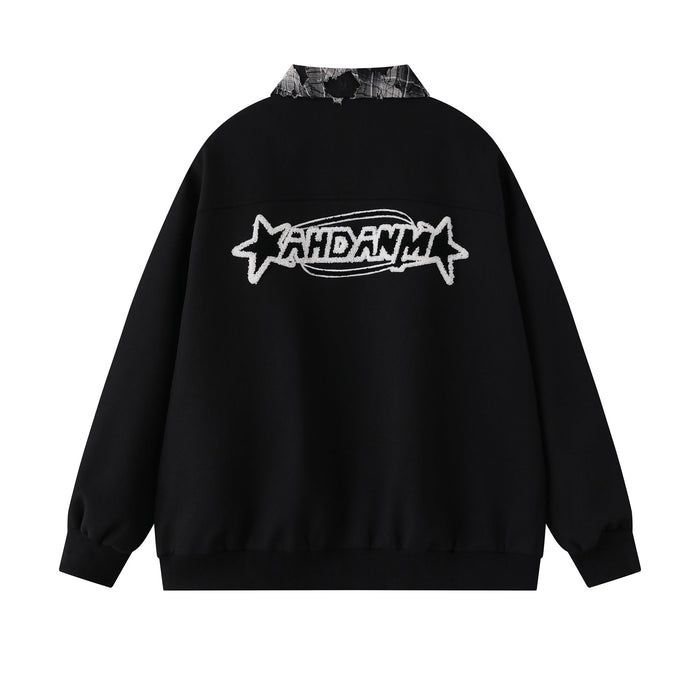 Back view of black varsity jacket with large star logo embroidery across the shoulders