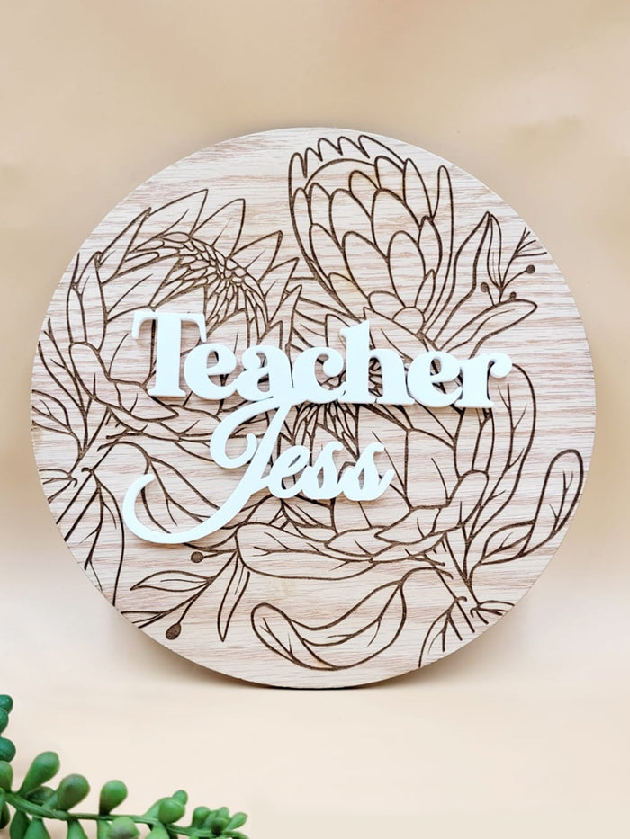 Personalised floral wooden plaque with 'Teacher' engraving, made from oak veneer, ideal heartfelt gift or desk ornament.