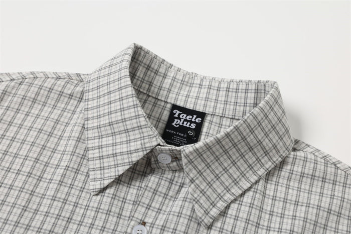 Light gray plaid shirt collar and upper chest with label