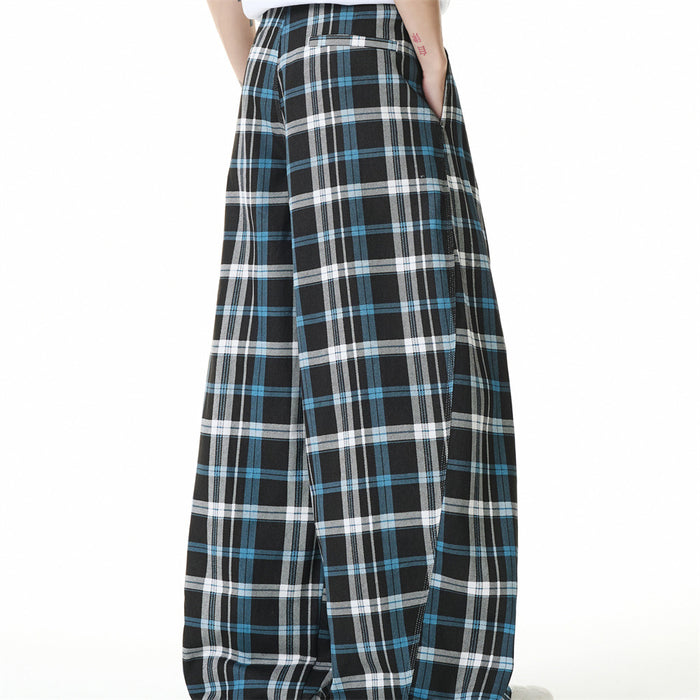 Side view of black plaid trousers with wide baggy legs and back pocket