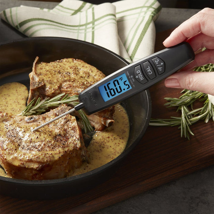 Person using PRO Digital Turbo Read Thermocouple Thermometer to check doneness of roasted meat in a skillet