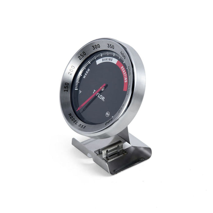 PRO Oven Thermometer with round dial on a metal base, tilted view.