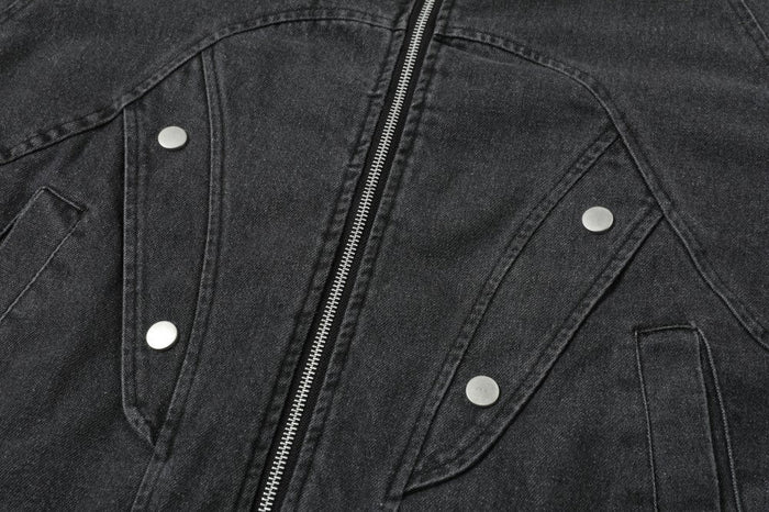 Close-up of the jacket front with zipper, snap buttons, and curved flap pockets
