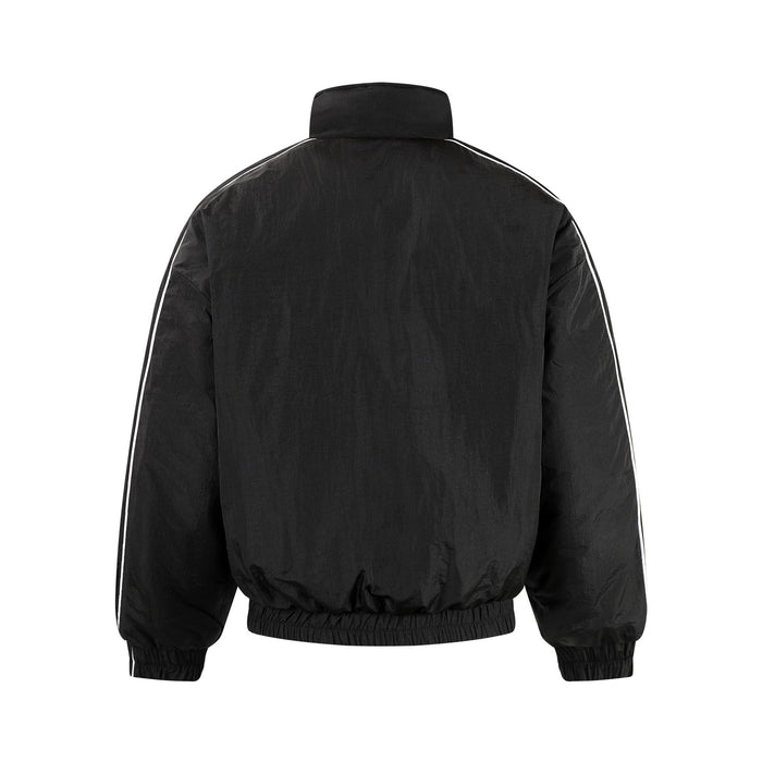 Black track jacket back view with white piping and elastic hem