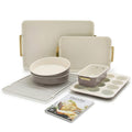 Reserve 7-piece latte bakeware set, including heavy-gauge aluminized steel pans, loaf tin, muffin tray, cooling rack, and recipe book.