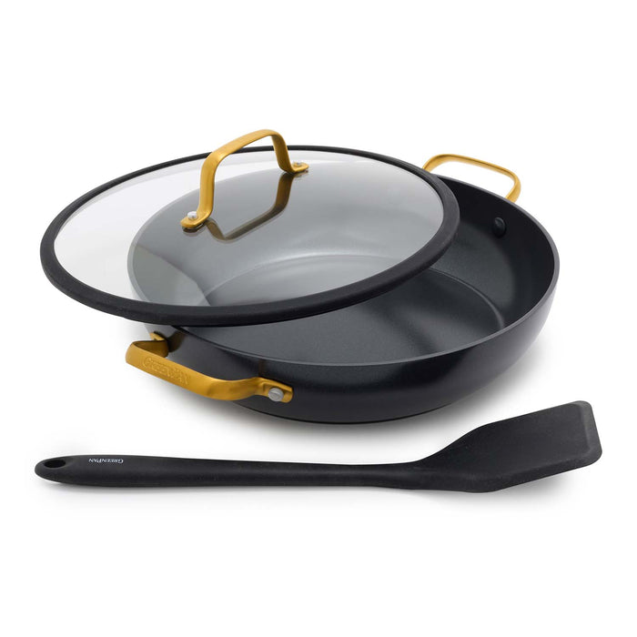 Black ceramic everyday pan with gold handles, glass lid, and included spatula shown together.