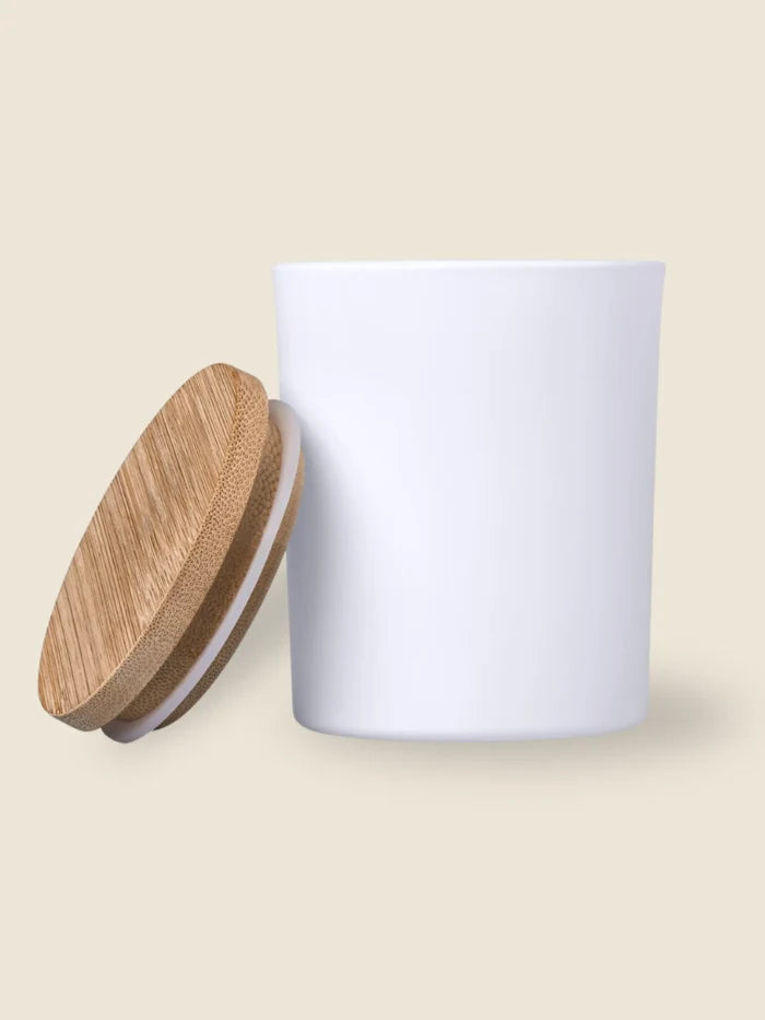 White ceramic jar with a wooden lid on a beige background