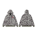 Front and back view of an oversized grey washed zip hoodie with all-over black star print and olive green ribbed cuffs