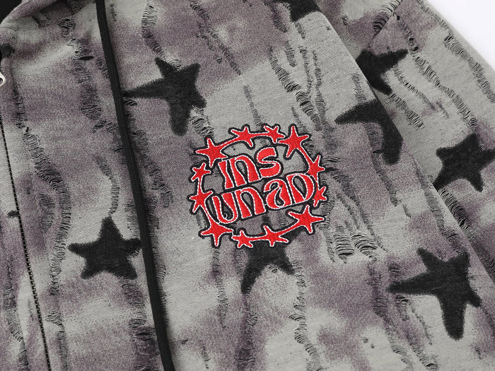 Close-up of front chest patch and zipper on star print hoodie