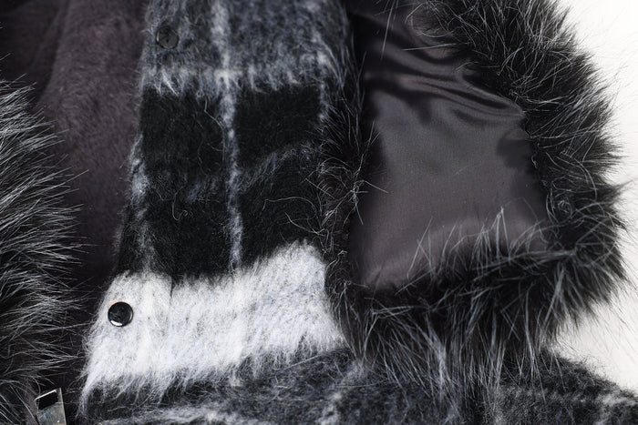 Close-up of jacket hood lining and plaid fabric with snap detail