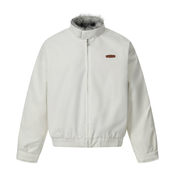 Off-white bomber jacket with grey faux-fur stand collar, front zip closure, and brown leather logo patch on chest