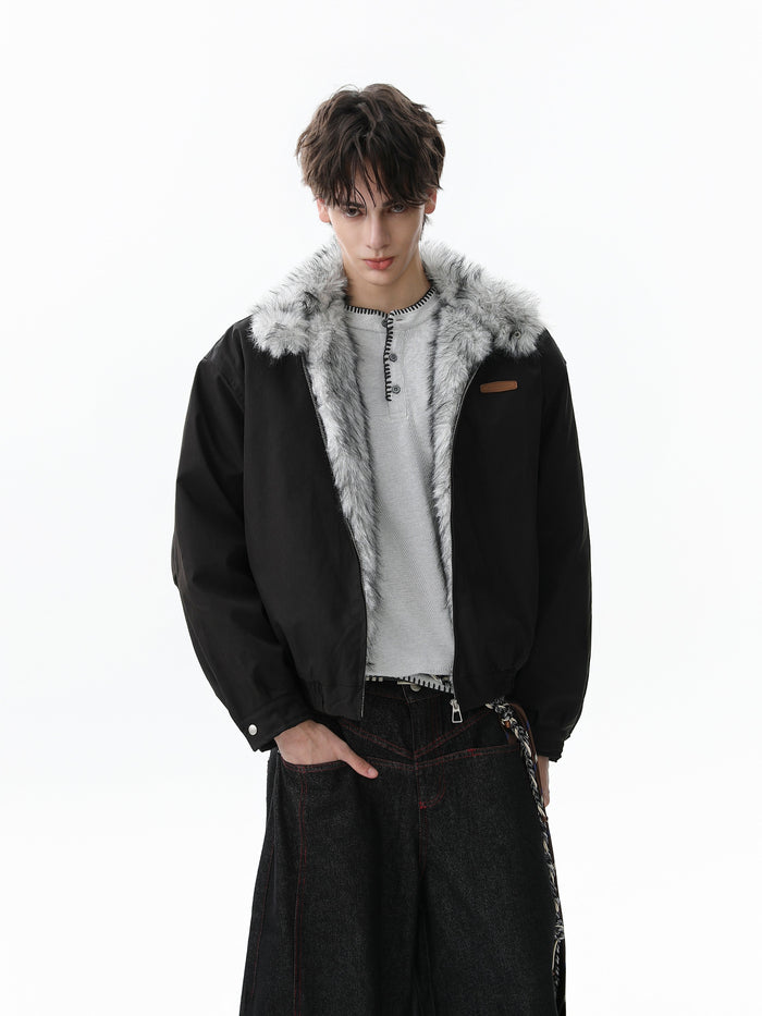 Black bomber jacket on model, open front showing faux-fur lining