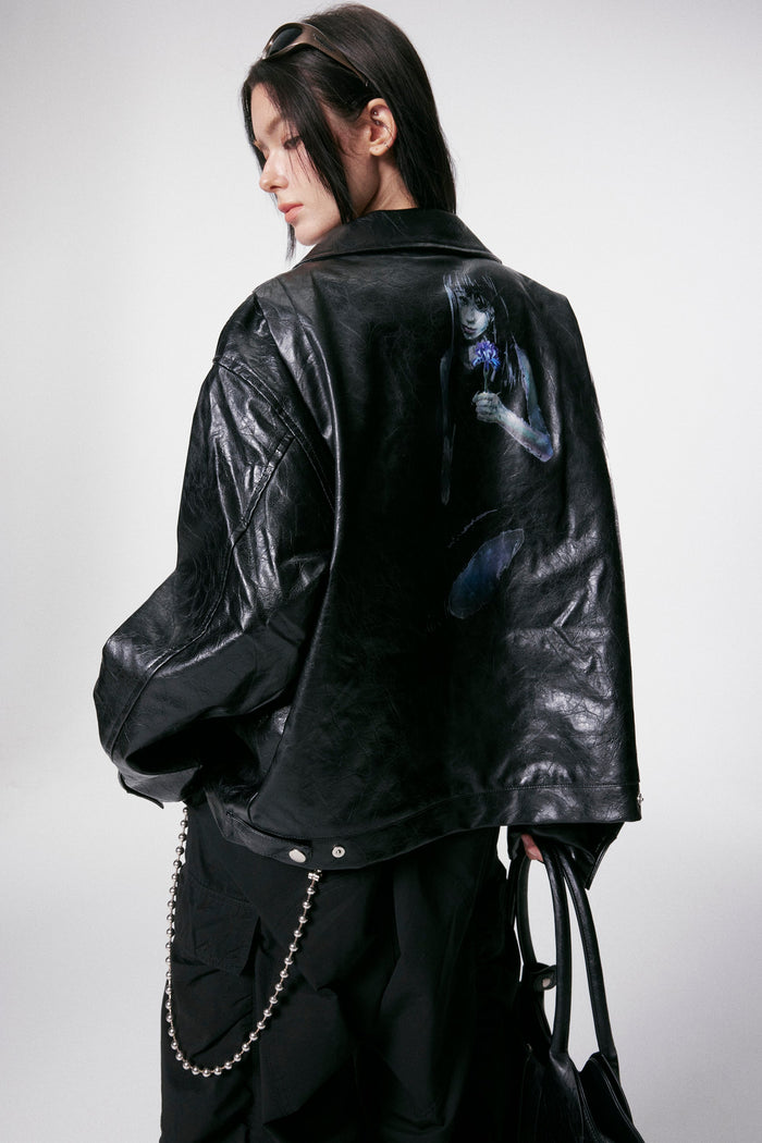 Back view of black PU leather jacket showing printed girl with purple flower