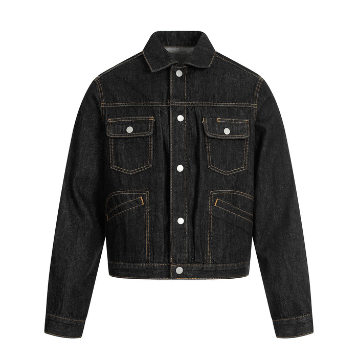 Front view of a black cropped denim jacket with contrast stitching and flap pockets