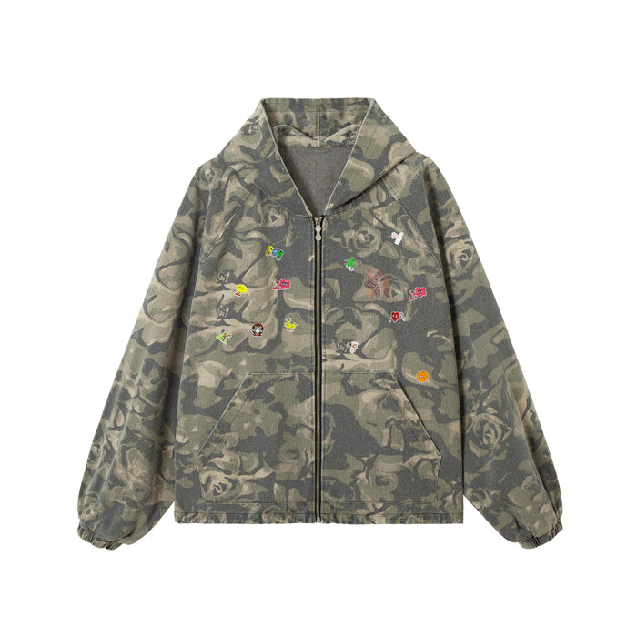 Olive rose camouflage zip-up hoodie with colorful embroidered patches across the chest, relaxed fit, front view