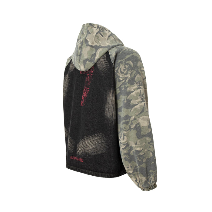 Back angled view of rose camo hoodie with black graphic panel and red embroidered detail