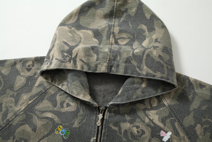 Close-up of rose camo hood and top zipper on a zip-up hoodie