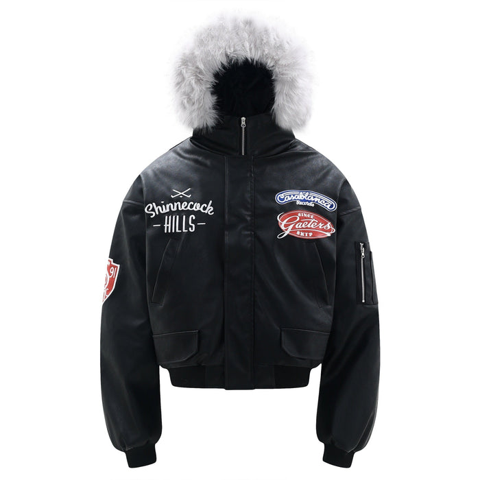 Black PU cropped bomber jacket with white faux fur hood trim and Shinnecock Hills embroidered patches on front