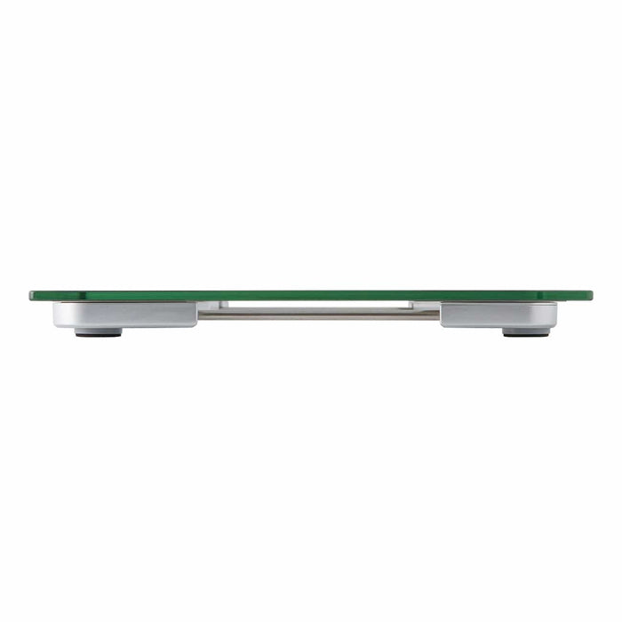 Slim glass weight scale with metal supports seen from the side