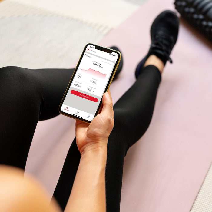 Phone screen shows weight 150.6 lb BMI and a chart in the Precision Hub App