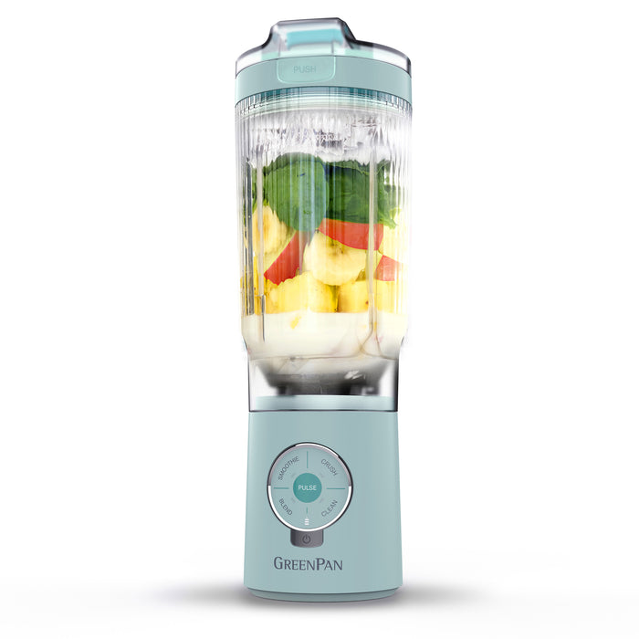 Portable blender with fruits inside on a white background, featuring the brand 'GreenPan'.