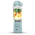 Portable blender with fruits inside on a white background, featuring the brand 'GreenPan'.