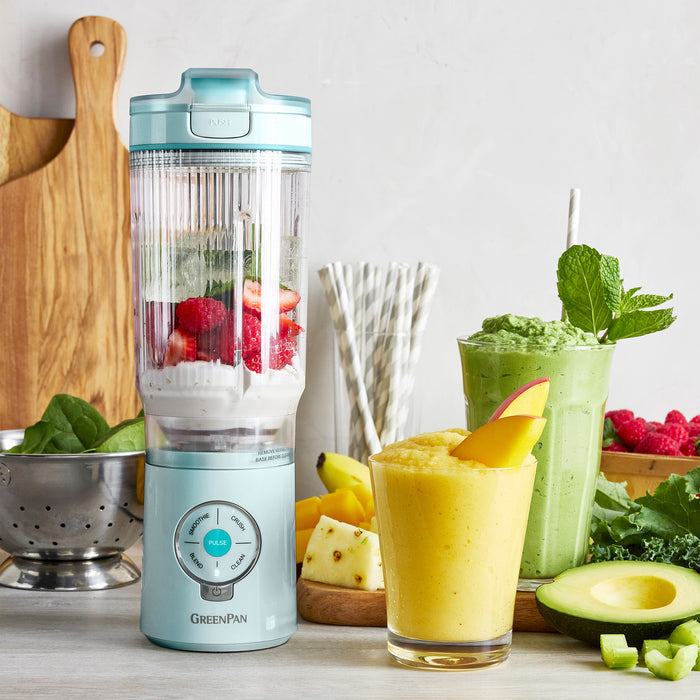 GreenPan blender with ingredients and smoothies on a table