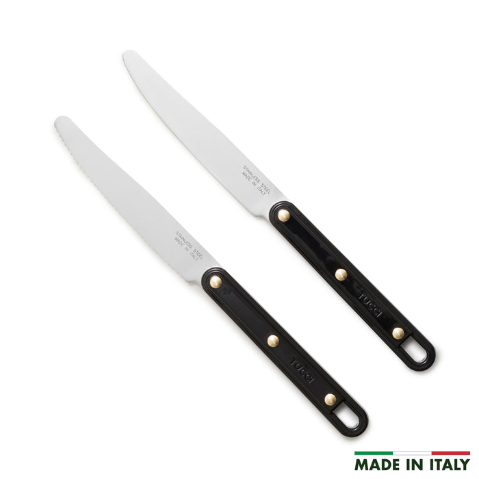Two kitchen knives with black handles on a white background, featuring 'Made in Italy' text.