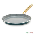 Teal crepe pan with a gold handle on a white background