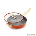 Ceramic pan in Amalfi Sunset with gold handles and glass lid, “MADE IN ITALY” in small text at bottom right.