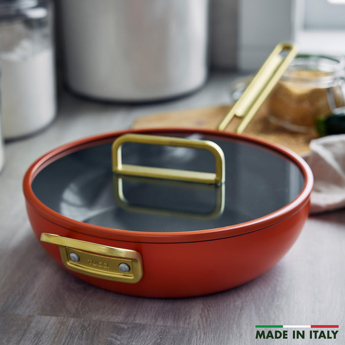 Ceramic nonstick 4.5-quart pan in Amalfi Sunset color on a kitchen counter, MADE IN ITALY text in corner.