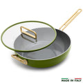 Green saute pan with glass lid on a white background