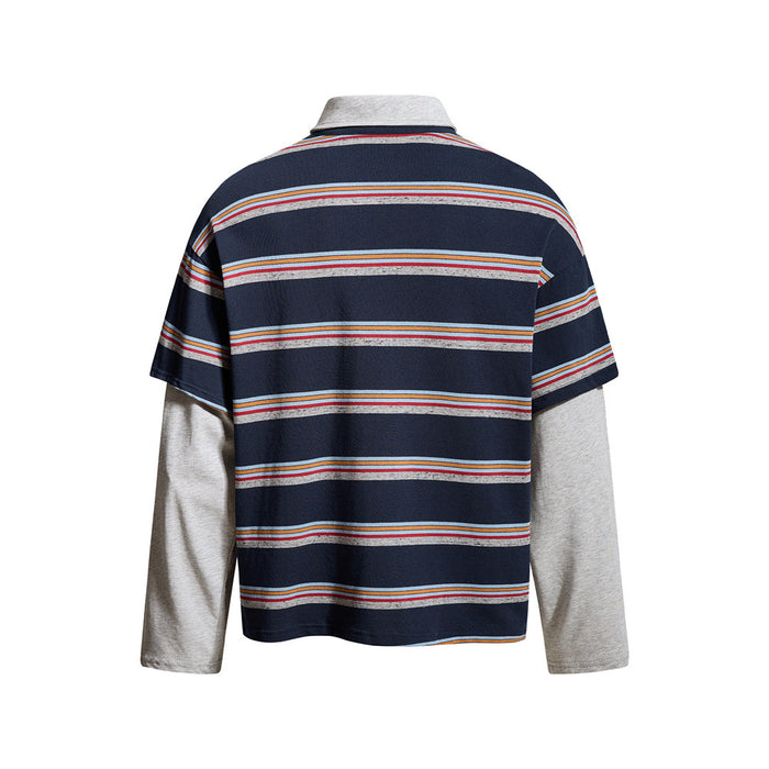 Back view of navy striped faux two-piece polo shirt with light gray sleeves