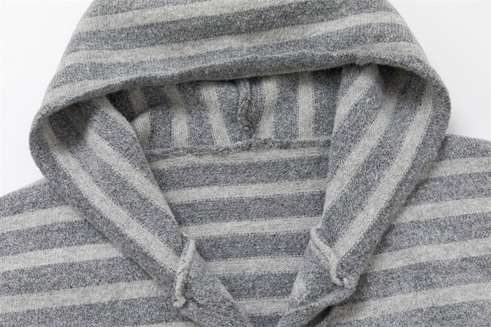 Close-up of the hood on a gray striped knit cardigan with drawstring opening