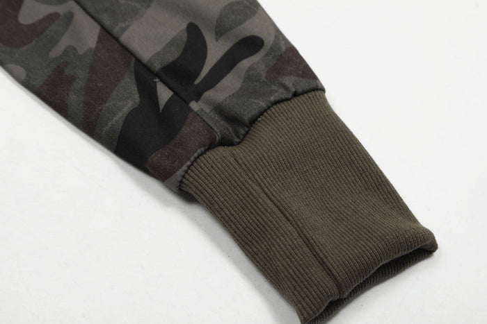 Close-up of camo jacket sleeve with olive ribbed cuff