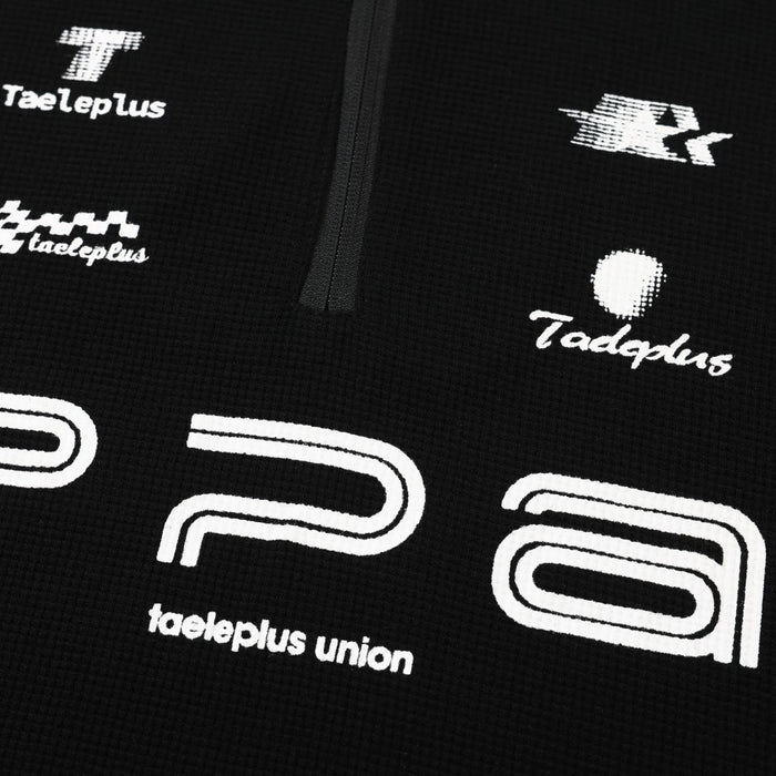 Close-up of black sweatshirt front with PPA graphic print and half-zip detail