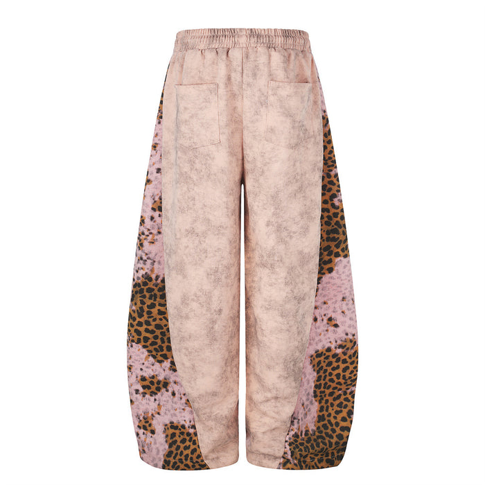 Back view of pink wide-leg sweatpants with leopard print side panels and back pockets