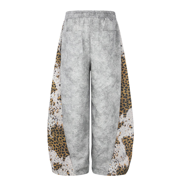 Back view of gray wide-leg sweatpants with leopard print side panels and back pockets