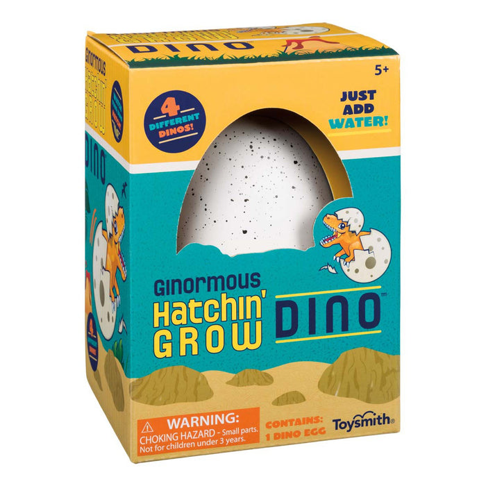 The Toysmith Ginormous Hatchin' Grow Dino Egg is a boxed kids’ toy featuring a large speckled egg visible through a window. The package shows a cartoon dinosaur and child, says “Just Add Water!” For ages 5+. Contains 1 dino egg. Brand: Toysmith.