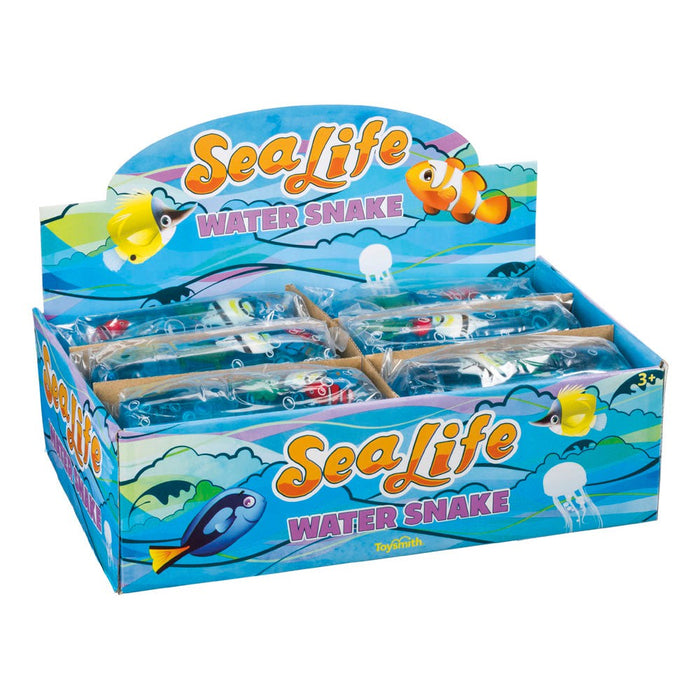 The Toysmith Sealife Water Snake by Toysmith comes in a colorful display box with ocean graphics and cartoon sea animals. Each transparent, squishy tube sensory toy features sea life designs and is individually wrapped.