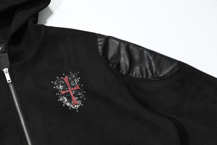 Close-up of front chest emblem on black hooded jacket with red cross design