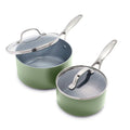 Two light sage green ceramic saucepans with stainless steel handles and clear glass lids, shown as a set.