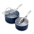 Two twilight blue saucepans with silver handles and glass lids; one lid open, one closed. Set of two sizes.