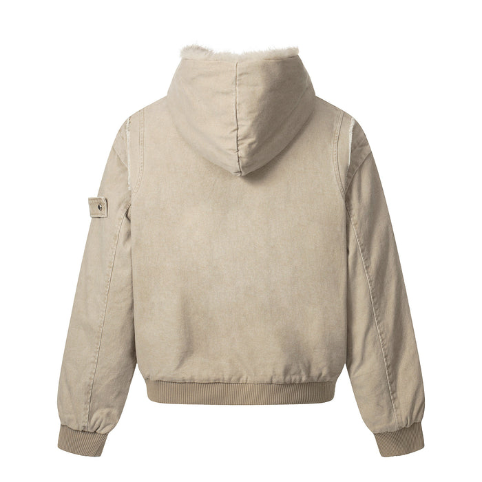 Back view of beige washed denim bomber jacket with shearling hood and ribbed hem