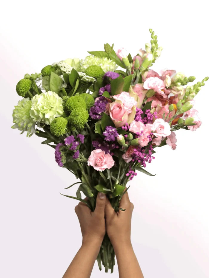 A vibrant bouquet of green and pink flowers, embodying boldness and beauty, inspired by Wicked's essence.