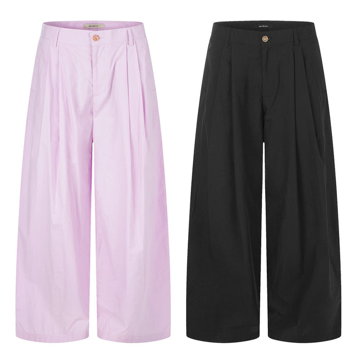 Wide-leg pleated trousers in light pink and black, front view